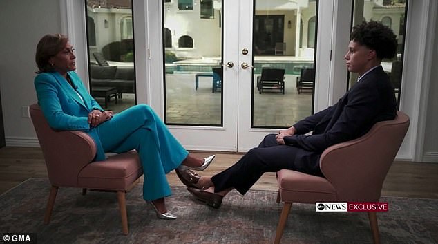 The 6-foot-2 Griner is seen with her legs stretched out for ABC's Robin Roberts