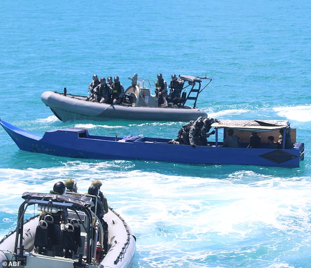 An illegal Indonesian fishing vessel is stopped by Australian authorities off the coast of Kimberley in March (photo)