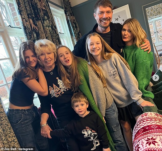 On social media last month, Zoe shared a photo of her mother surrounded by family members