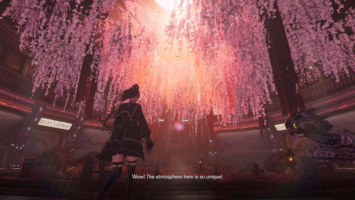 EVE, the protagonist of Stellar Blade, dressed in a schoolgirl uniform and black thigh-highs, looks up at a ceiling full of hanging pink flowers.  She says, “Wow!  The atmosphere here is so unique!”