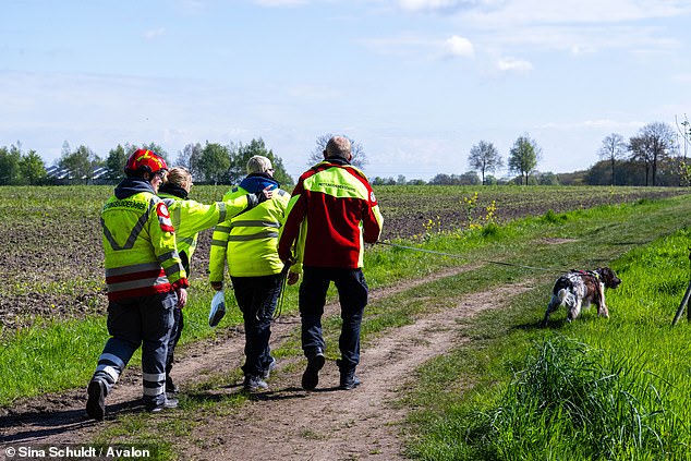 Emergency services with sniffer dogs run along a dirt road in Elm, Lower Saxony, in a frantic search for Arian