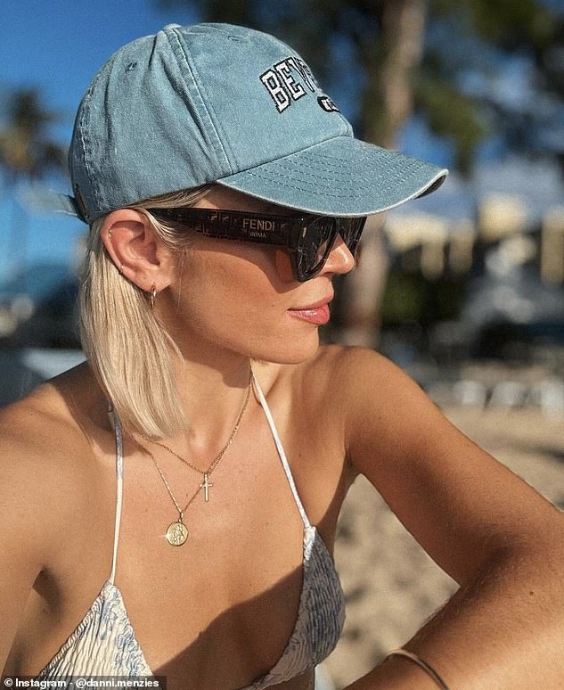 In another photo, Danni looked particularly blonde, showing off her side profile with Fendi sunglasses and a denim baseball cap