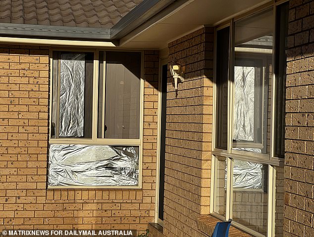 The windows of Daniel Billings' home were covered with aluminum foil to block out the sun