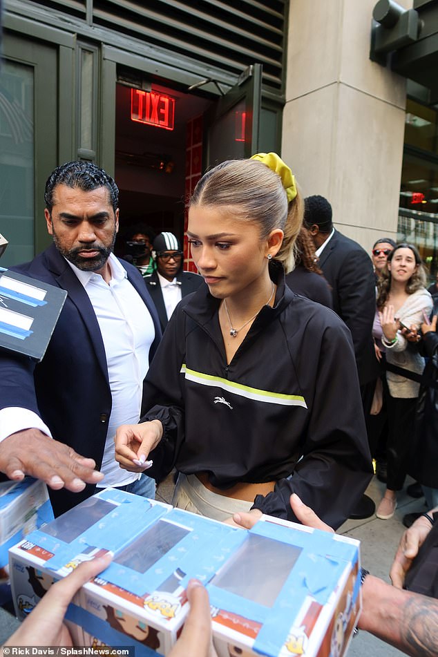 She appeared to be signing autographs for fans