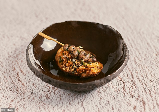 Minced chicken on toast with toasted sourdough, grilled chicken heart, soft herb pesto and seeds