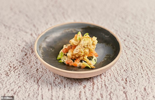 Crispy fried cod tongues with sauce gribiche (a cold egg sauce in French cuisine) and nettle leaf tomato salad