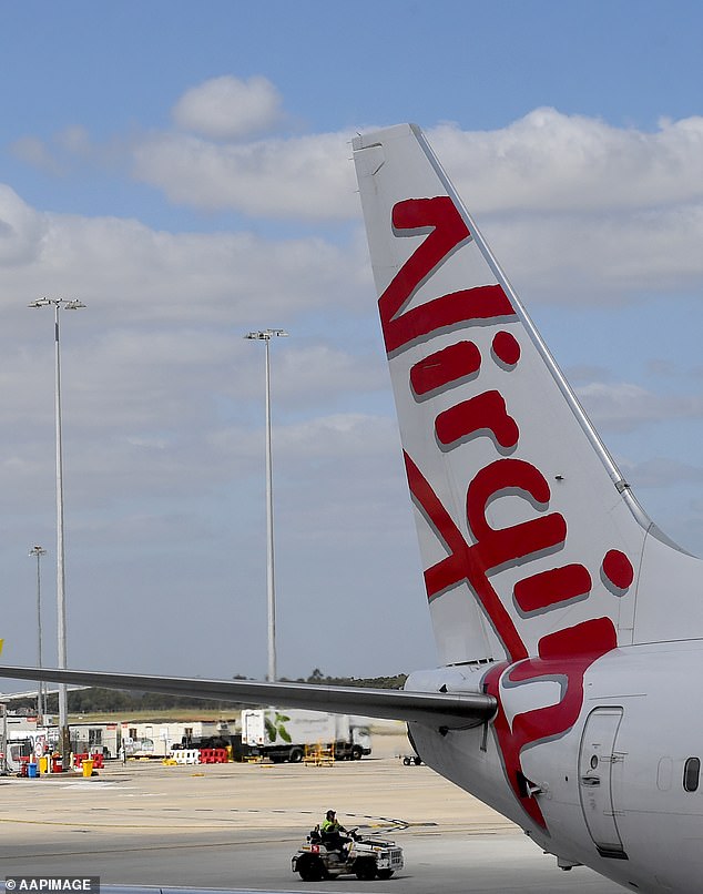 Holidaymakers can still travel from Adelaide to Bali with Virgin, but their journey time will now increase to around 14 hours, with passengers having to stop over in Brisbane, Sydney or Melbourne and transfer to a connecting flight.  A virgin airplane is depicted