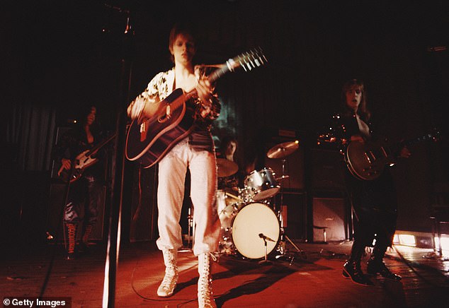 David Bowie performing with The Spiders From Mars on the first night of the Ziggy Stardust Tour at Borough Assembly Hall in Aylesbury, Buckinghamshire on January 29, 1972. From left: Trevor Bolder, David Bowie, Mick 'Woody' Woodmansey and Mick Ronson