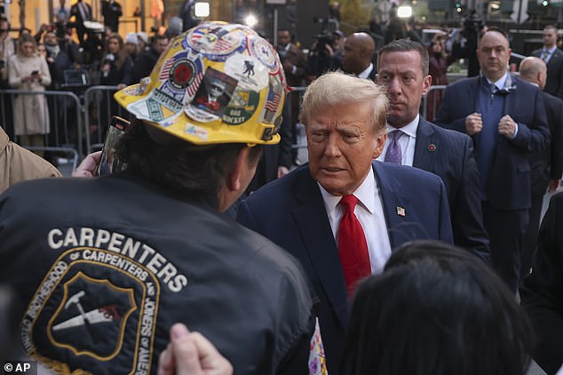 Before heading to Manhattan Criminal Court on Thursday morning, Donald Trump stopped by greeting hundreds of union workers and signing MAGA hats