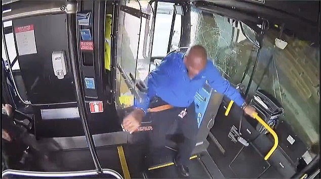 The bus driver is unable to get behind the wheel before crashing into a building