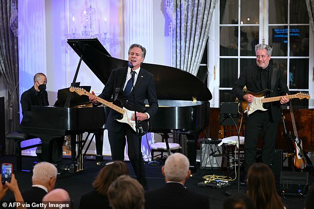 Secretary of State Antony Blinken performs a Muddy Waters song during a celebration to mark the launch of the Music Diplomacy Initiative in September 2023