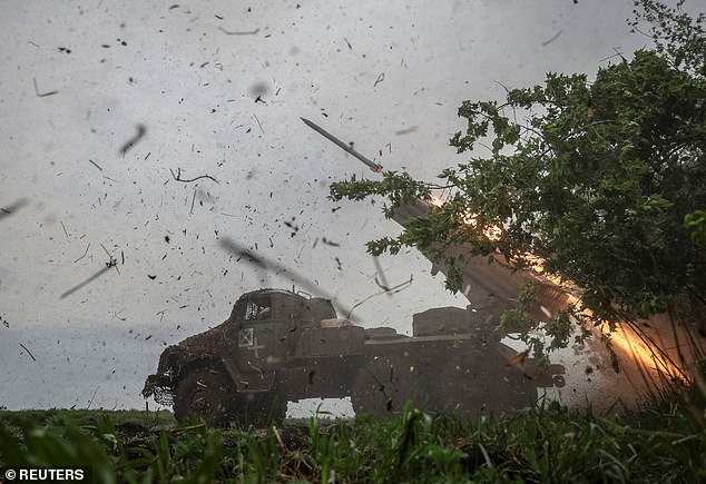 Ukrainian soldiers of the 25th Separate Airborne Brigade of the Armed Forces of Ukraine fire a BM-21 Grad multi-launch missile system at Russian forces