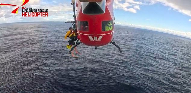 The boat, the Temptress, was almost completely submerged when the group called triple zero and was brought to safety on Friday afternoon.