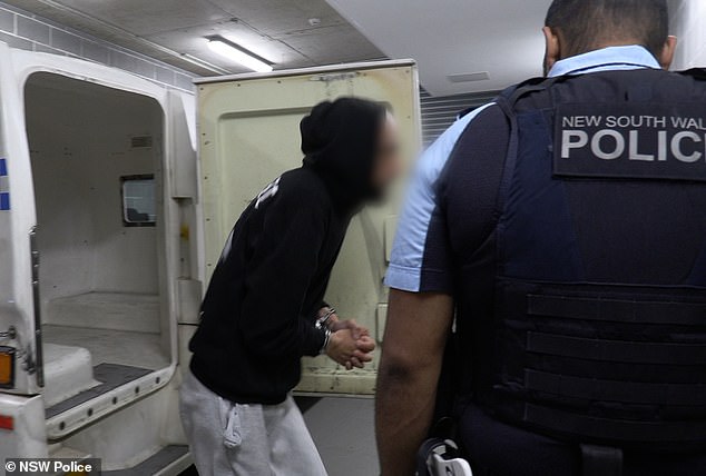 The man (left) was taken to Granville police station where he was charged with rioting and throwing missiles at a police officer in public disorder.