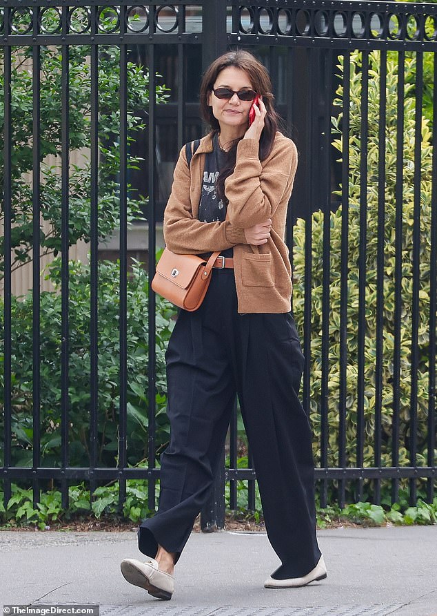 The actress and director, 45, was the epitome of casual-cool during her leisurely stroll, wearing black pants with a matching cropped T-shirt with a photo of NY punk icons the Ramones on the front, which is a staple of her for years