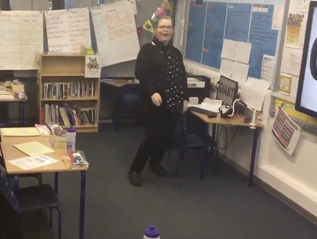 The killer is seen performing a dance routine and laughing in the school where she taught