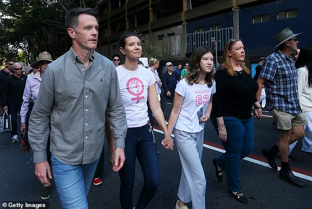 NSW Premier Chris Minns (pictured left) and Housing Minister Rose Jackson (pictured right) marching at a rally in Sydney