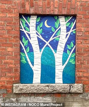 One of the other murals shows a nighttime scene of two trees