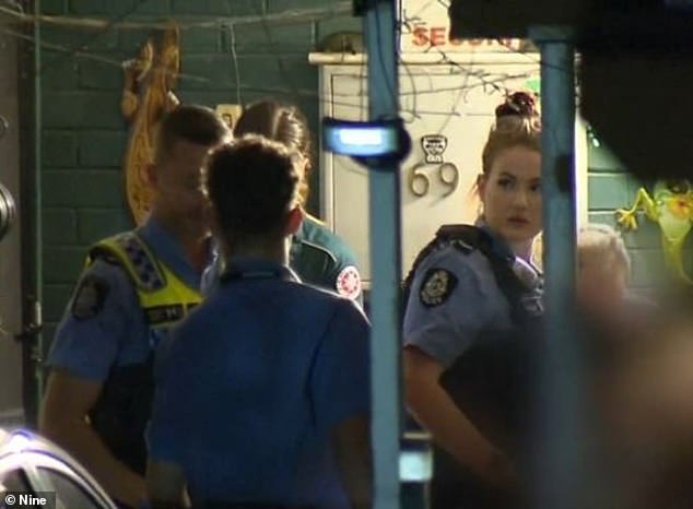 Jamshidi Doukoshkan and two other men allegedly posed as police officers to gain access to the elderly couple's home (photo, emergency services on scene)