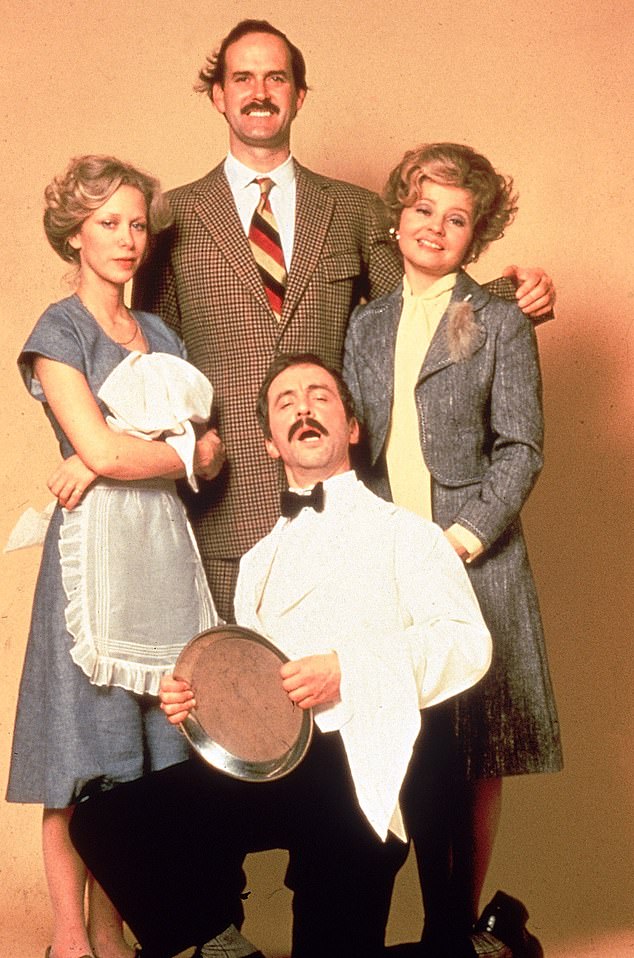 From left to right: Connie as Polly, John as Basil Fawlty, Prunella Scales as Sybil Fawlty and Andrew Sachs (kneeling) as hapless Spanish waiter Manuel in a promotional photo