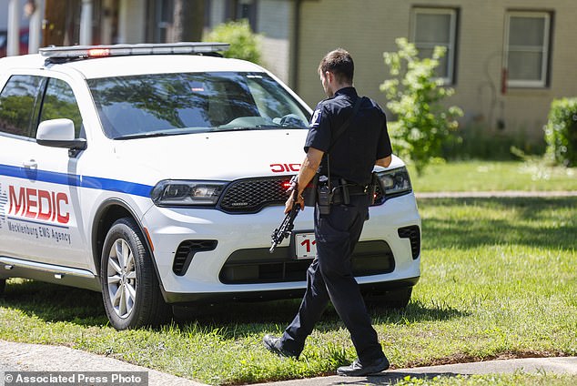 The officers were first shot at by the wanted suspect as they approached the suburban Charlotte home and killed him in the front yard.