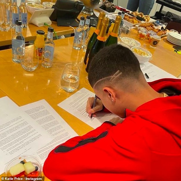 Junior received a major new recording contract with Harry Styles' label Columbia in 2021 (photo signing his contract)