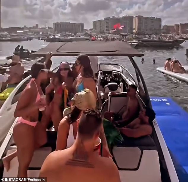 During Boca Bash, a bunch of men and bikini-clad women are seen packed onto a boat