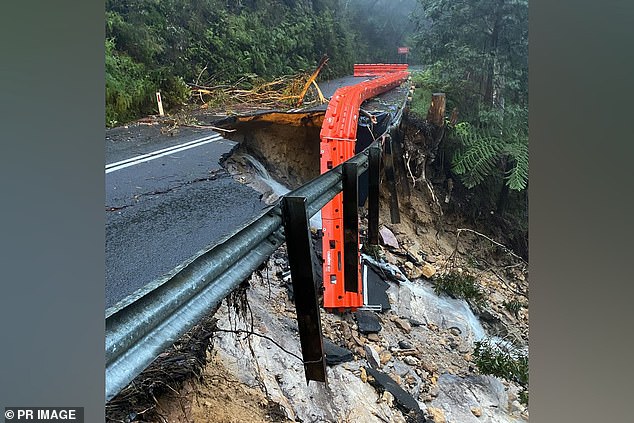 The only closed road in or out of the city, Megalong Road, was severely damaged after the deluge caused a landslide on Saturday (photo)