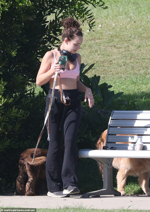 Abbie Chatfield took her new puppy Daisy and rescue dog Walter for a walk in a Sydney park on Thursday