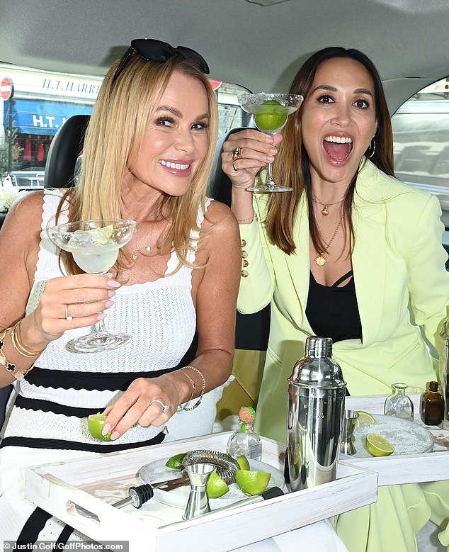 Amanda Holden (left) and Myleene Klass enjoyed a cheeky margarita in the back of a Lipsy-branded taxi on Wednesday as they celebrated her latest clothing line