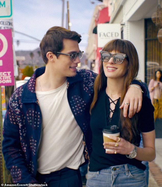 Anne Hathaway (right) claims the pop star character in her new romantic comedy The Idea of ​​You was inspired by Harry Styles.  Anne's character Solène sparks a romance with boy band member Hayes Campbell, played by Nicholas Galitzine (left)