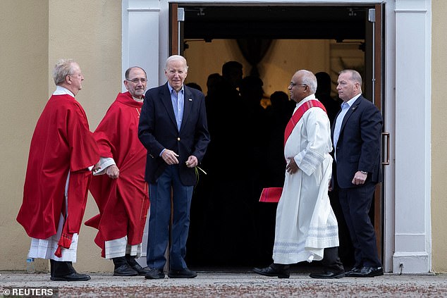 President Joe Biden speaks with faith leaders as he leaves St. Joseph at Brandywine Catholic Church in Greenville, Delaware