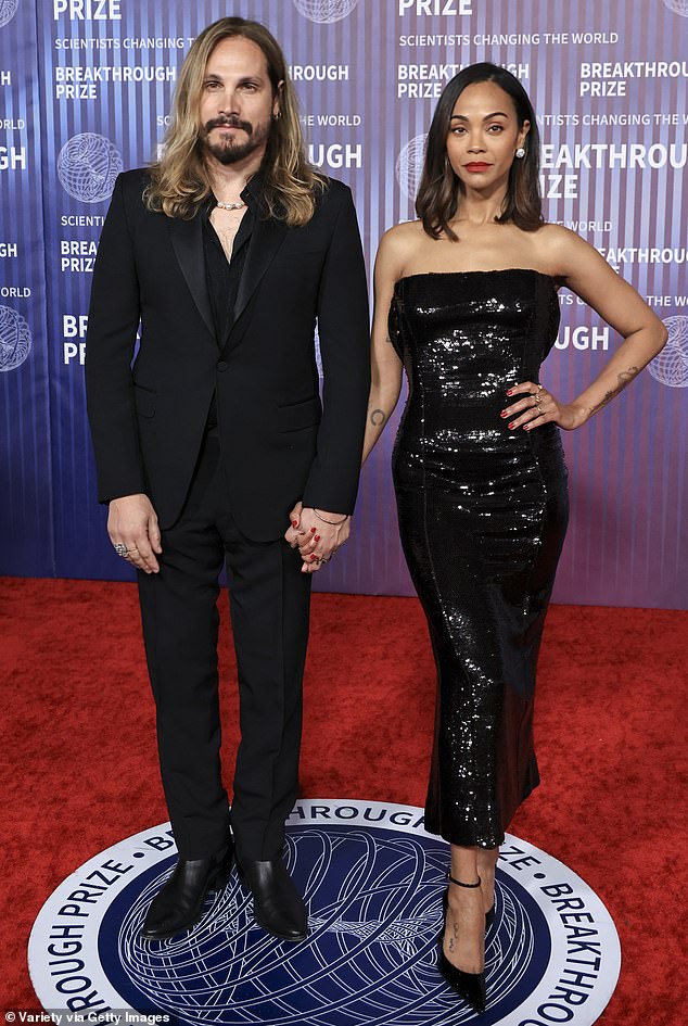 Zoe Saldana and her husband of 11 years, Marco Perego, dazzled in matching black ensembles at the 10th annual Breakthrough Prize event Saturday night in Los Angeles