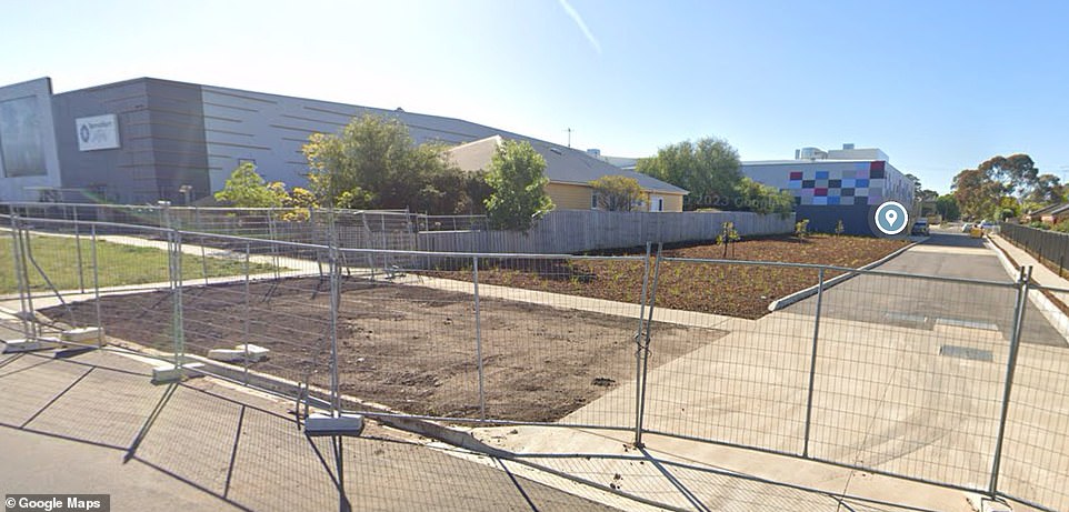 The parental home falls in the shadow of a shopping center that is building a parking garage nearby