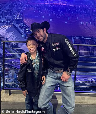 A sweet photo shows the National Cutting Horse Association Riders Hall of Famer with a young fan