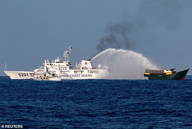 Chinese Coast Guard ships fire water cannons at a Philippine supply ship Unaizah on May 4 en route to a resupply mission at Second Thomas Shoal in the South China Sea