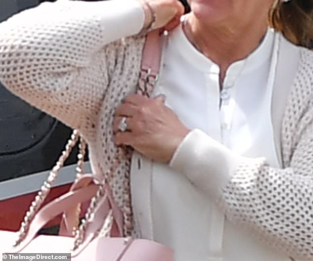 Melinda was seen with a huge diamond on her ring finger as she stepped out of the helicopter
