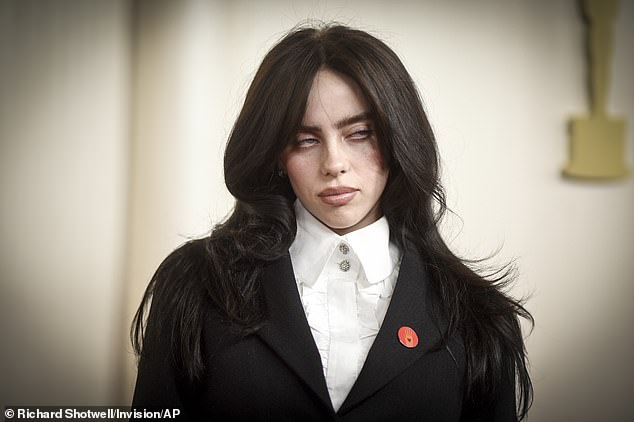 Billie Eilish (pictured), Nicki Minaj and Katy Perry are among 200 high-profile artists calling for an end to the music industry's 'predatory' use of AI