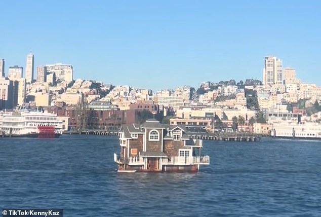 A large shingled houseboat was seen floating across San Francisco Bay after its owners were evicted from the nearby marina that once housed more than 100 residents