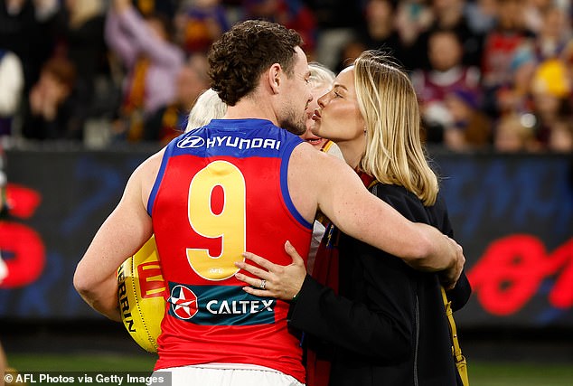 Lachie Neale and his wife Jules were on the MCG field on Thursday evening