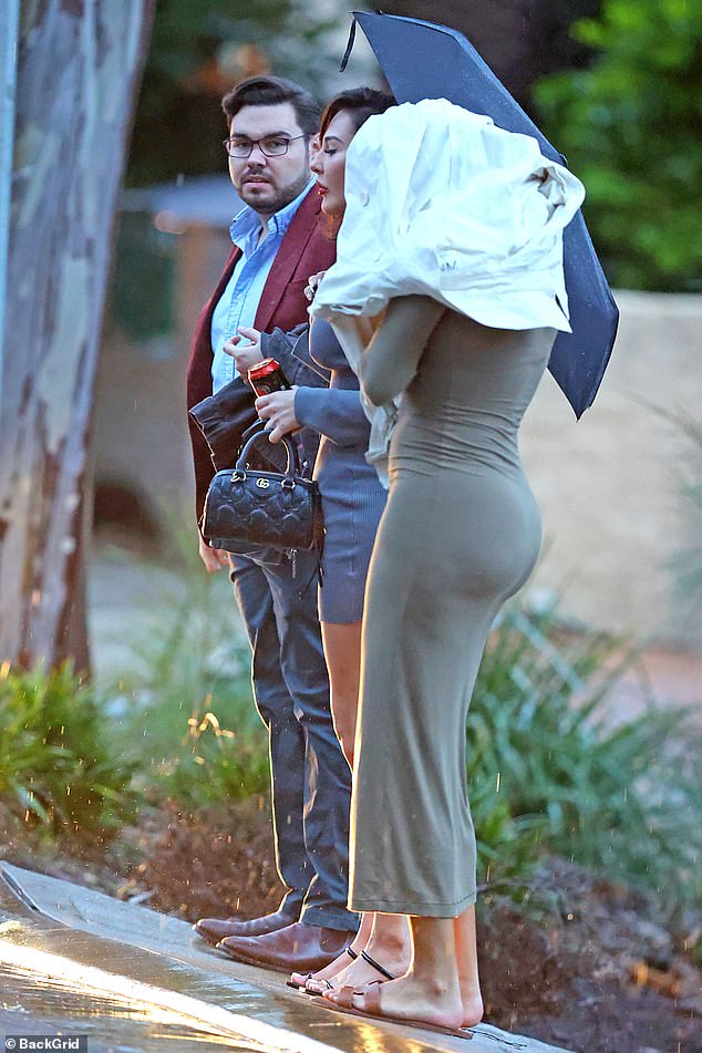 Bruce Lehrmann is pictured with two women on Tuesday, shortly after the date was set for his defamation trial