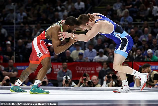 Jason Nolf (R) wrestles Jordan Burroughs (L) in a 74kg challenger tournament final during the U.S. Olympic Wrestling Trials held Friday at the Bryce Jordan Center