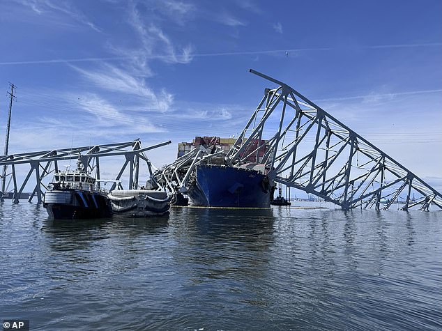 Dive teams examined parts of the bridge and checked the ship over the weekend, and workers in elevators used torches to cut parts of the twisted steel superstructure above water
