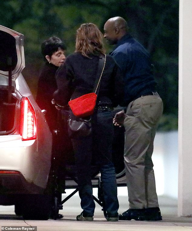 Liza Minnelli was helped out of her car and into her wheelchair as she returned to her Beverly Hills home on March 28.