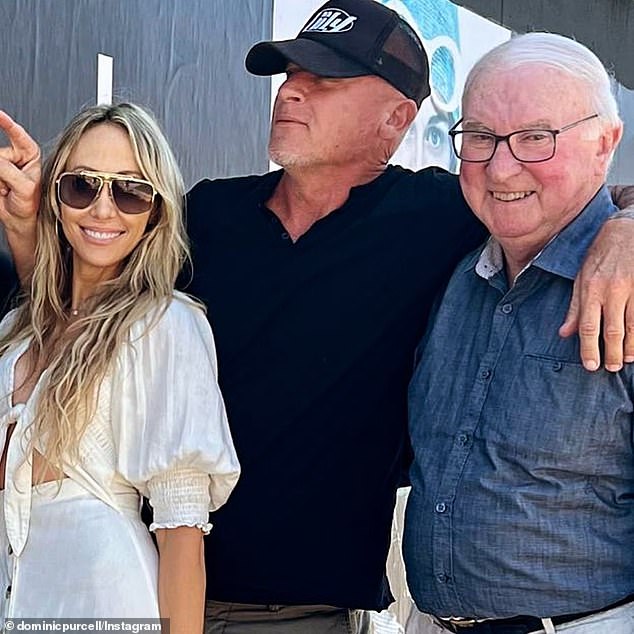 Dominic Purcell announced the news of the death of his father Joseph at the age of 80 on Tuesday.  He shared this throwback photo of himself (center) posing with wife Tish Cyrus (left) and father Joseph (right) alongside a heartbreaking caption