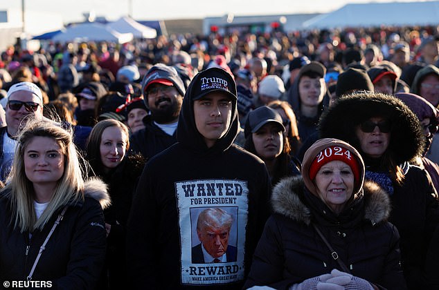 A Trump supporter wearing a hoodie with the ex-president's mugshot on it at his rally in Schnecksville, PA, on Saturday