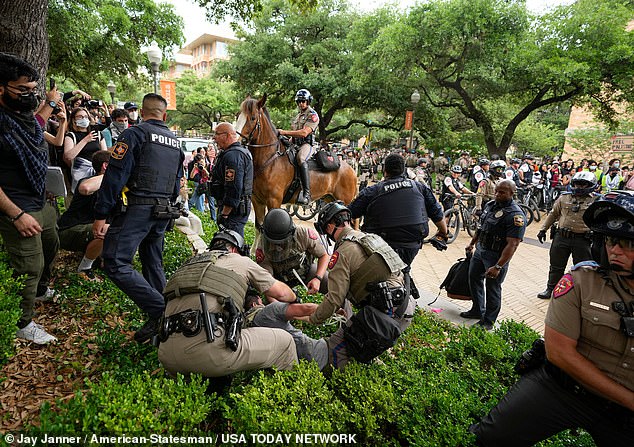 Police arrested at least four protesters at UT Austin after warning them they could face criminal charges if they didn't disperse