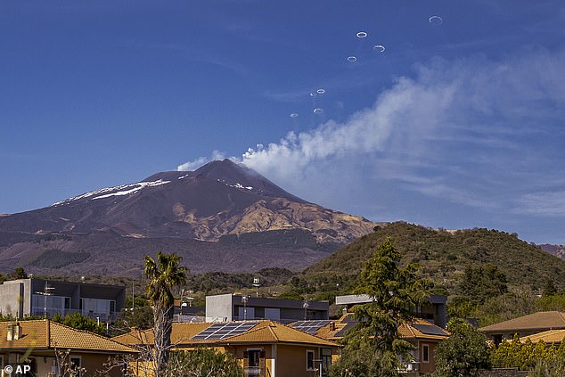 Italy's Etna put on a spectacular show for amazed tourists as they watched the volcano blow rings of smoke into the sky