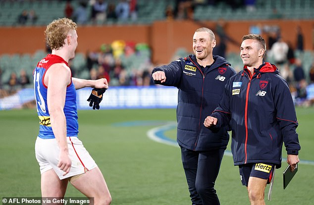 Demons coach Simon Goodwin (pictured center after the team's win over Adelaide on Thursday night) has been criticized by fans for a post-match comment