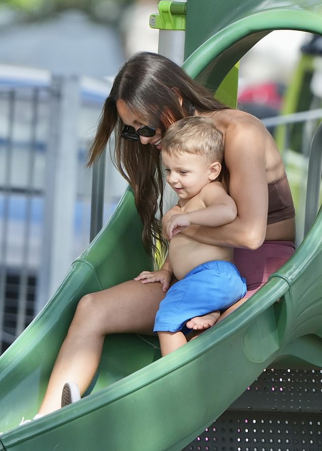 Kayla Itsines, 32, soaked up the sun in her new neighborhood while spending time with her little ones on the Gold Coast on Sunday